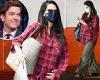 Pregnant Olivia Munn covers her bump in a flannel amid fan speculation about ...