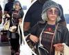 Doja Cat bundles up in black and tan as she jets out of NYC after hosting the ...