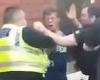 Moment police officer PUNCHES drinker in the FACE during frenzied tussle to ...