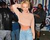 Former Neighbours star Nicky Whelan shows off her six-pack abs in a crop top