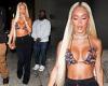 Saweetie looks like a treat as she sucks on a lollipop while making her wat to ...