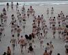 Hundreds strip off at sunrise for mass skinny dip in the North Sea