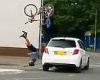 Terrifying moment cyclist, 27, was sent flying into the air after being hit by ...
