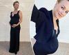 Yvonne Strahovski cradles her baby bump in a chic black couture gown for Emmy ...