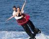 Romantic flyboarder stuns crowd with 007-style tricks... and a marriage ...