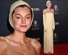Emma Corrin channels The Crucible with her pale yellow bonnet at Emmy Awards