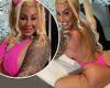 Amber Rose flaunts her peachy derriere in neon pink thong swimsuit