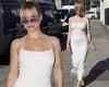 Lottie Moss showcases her figure in a white midi dress as she launches her new ...
