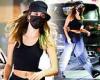 Hailey Bieber flashes her washboard abs in a black crop top and tracksuit ...