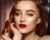 Phoebe Dynevor oozes Hollywood glamour with a sultry red lip