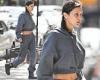 Bella Hadid teases her taut abs in a gray sweat-suit while out strolling around ...