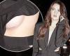 Maya Henry displays a scar on her breast as she leaves PFW show in a plunging ...