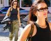Bella Hadid sports a black tank top with army green trousers while running ...