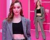 Phoebe Dynevor flashes her toned midriff in a black crop top at the Canneseries