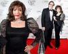 Joan Collins wears black gown as she cosies up to husband Percy at charity ball