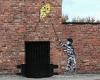 A mural by Banksy has appeared overnight on the wall of a Stockport pub in ...