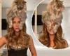 Kate Beckinsale poses with her huge pet cat on top of her head