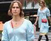 Tommy Dorfman struts through New York City in a light blue dress while lingerie ...