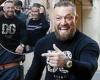 Conor McGregor is mobbed by fans while going for a stroll with partner Dee ...