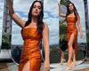 Katy Perry shows off sensational legs in shimmering orange split dress plugging ...