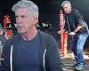 Tom Bergeron goes casual in a zip-up hoodie while filling up his tires in ...