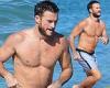 Scott Eastwood shows off his shirtless, buff body in swim trunks as he's seen ...