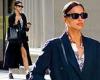 Irina Shayk rocks a black trench coat and tote with her initials on it while ...