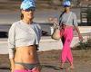 Alessandra Ambrosio flashes toned midriff as she enjoys hangout on the beach in ...