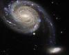 Space: Hubble telescope spots two 'squabbling' galaxies locked in a cosmic dance