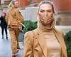 Karlie Kloss looks ready for business in a tan suit at a W Magazine board ...