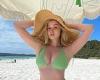 Simone Holtznagel shows off her sensational curves and ample cleavage in a mint ...