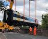 Massive crane removes wreckage of Salisbury train crash from the rails