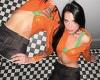 Dua Lipa showcases her toned midriff in  orange crop top as she poses for a ...