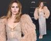 Suki Waterhouse flashes her bra in a perilously plunging lace dress