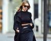 Abbey Clancy flashes her toned midriff in typically chic all-black look