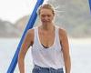 Gemma Ward shows off her trim figure as she and partner take their children to ...