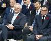Scott Morrison and Dan Andrews sit together at Remembrance Day event