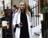 Kimberley Garner looks chic in a white trench coat and black roll neck top ...