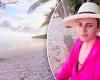 Rebel Wilson rocks a hot pink top as she wakes up to a tropical sunrise while ...