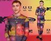 MTV EMAs: Olly Alexander commands attention in a multicoloured maxi dress