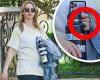Mia Goth covers her baby bump with a jean jacket as she flashes an engagement ...