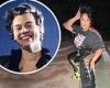Lizzo cheers on friend Harry Styles while wearing custom merch to his LA concert