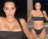 Kim Kardashian bares her curves in a bikini after she was seen holding hands ...