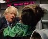 Bare-faced Boris! PM is seen travelling on a packed train WITHOUT a mask