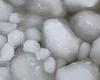 Thousands of frozen spheres cover the surface of Lake Manitoba in rare weather ...