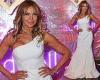 Lizzie Cundy exudes glamour in a busty white one-shouldered gown