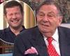 Barry Humphries 'outs' British TV host live on air in viral prank