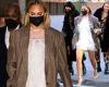 Chrissy Teigen puts on a leggy display in a fun white feathered mini dress in ...