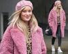 Laura Whitmore dons a fluffy pink coat and a matching beret as she departs from ...