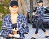 Chrissy Teigen beams as she flashes her abs in frayed plaid shirt and sports ...